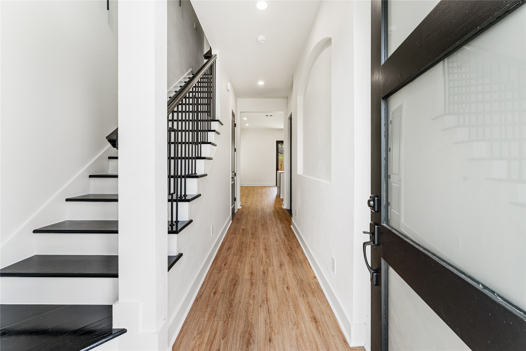 3620 Mt Pleasant Street, Unit A Houston, TX 77021 - Photo 2 of 23 a view of a hallway with wooden floor and staircase