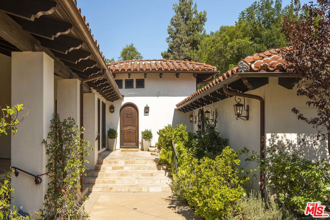 2251 Cold Canyon Road Calabasas, CA 91302 - Photo 44 of 47 a front view of a house with a yard