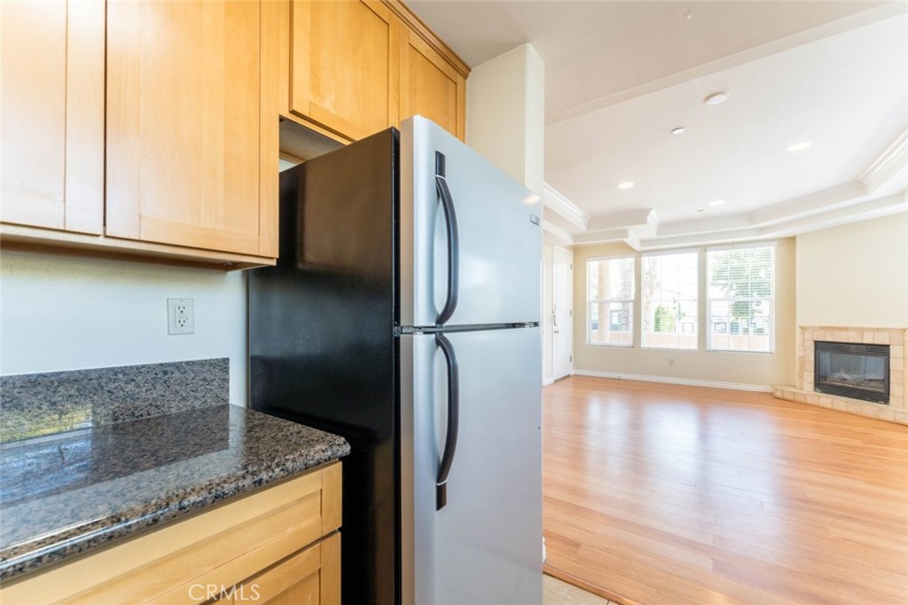 511 East Harvard Road, Unit 101 Burbank, CA 91501 - Photo 14 of 29 a kitchen with stainless steel appliances granite countertop a refrigerator and a sink