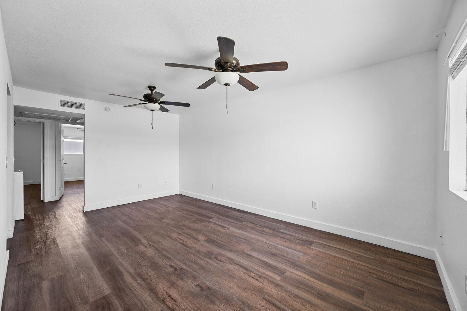 18202 North Cave Creek Road, Unit 252 Phoenix, AZ 85032 - Photo 11 of 15 a view of empty room with wooden floor