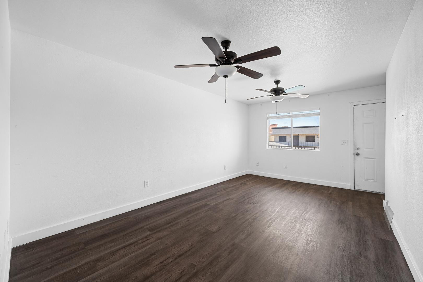 18202 North Cave Creek Road, Unit 252 Phoenix, AZ 85032 - Photo 12 of 15 wooden floor in an empty room