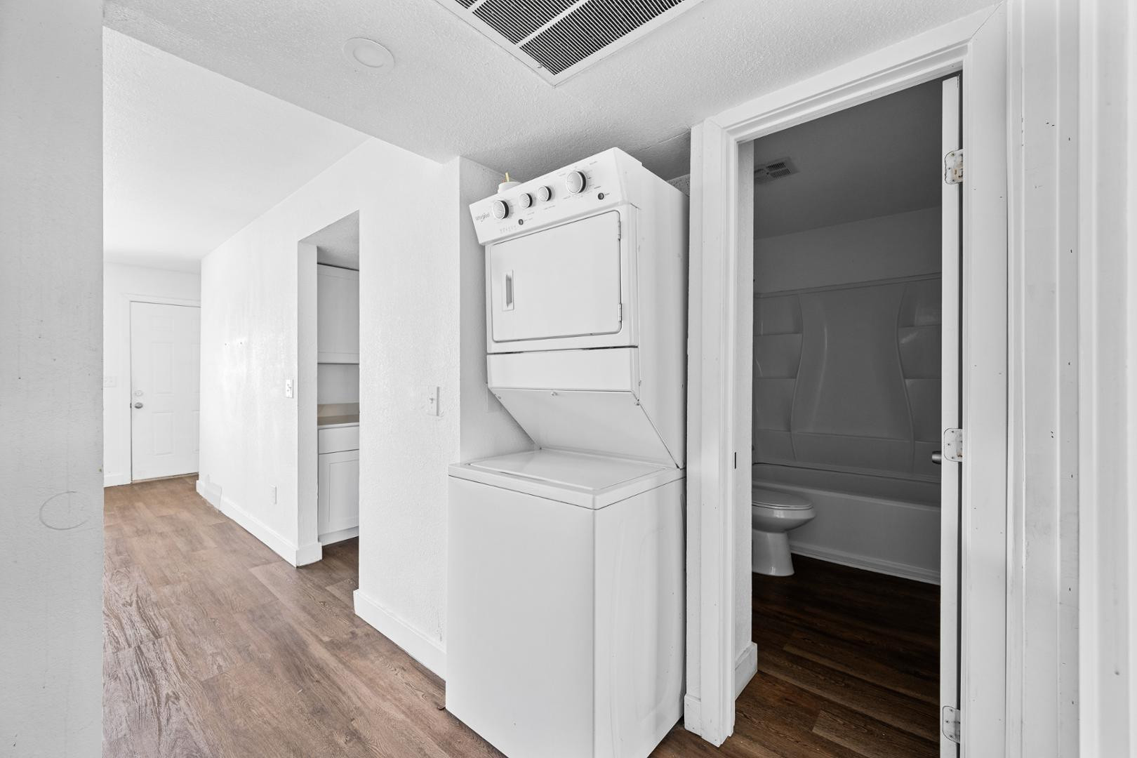 18202 North Cave Creek Road, Unit 252 Phoenix, AZ 85032 - Photo 10 of 15 a utility room with cabinets washer and dryer