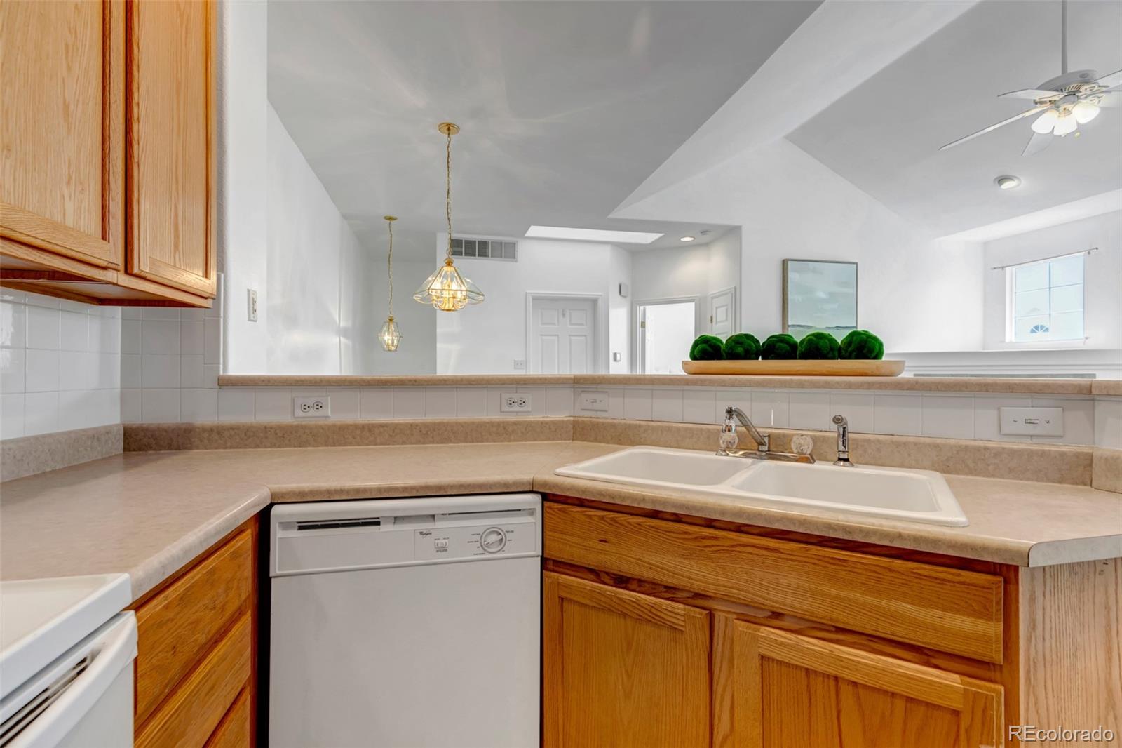 1237 Carlyle Park Circle Highlands Ranch, CO 80129 - Photo 13 of 33 a kitchen with a sink cabinets and a wooden floor