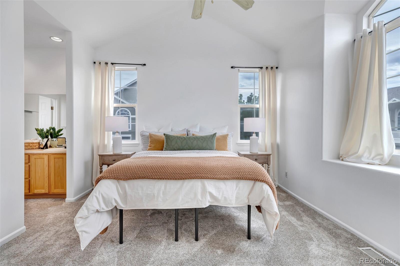 1237 Carlyle Park Circle Highlands Ranch, CO 80129 - Photo 15 of 33 a bedroom with a bed and a table in it