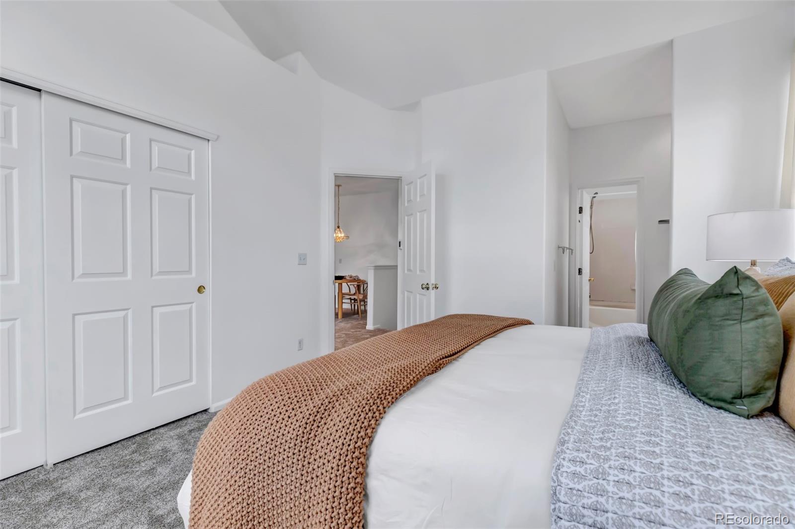 1237 Carlyle Park Circle Highlands Ranch, CO 80129 - Photo 17 of 33 a spacious bedroom with a bed and closet