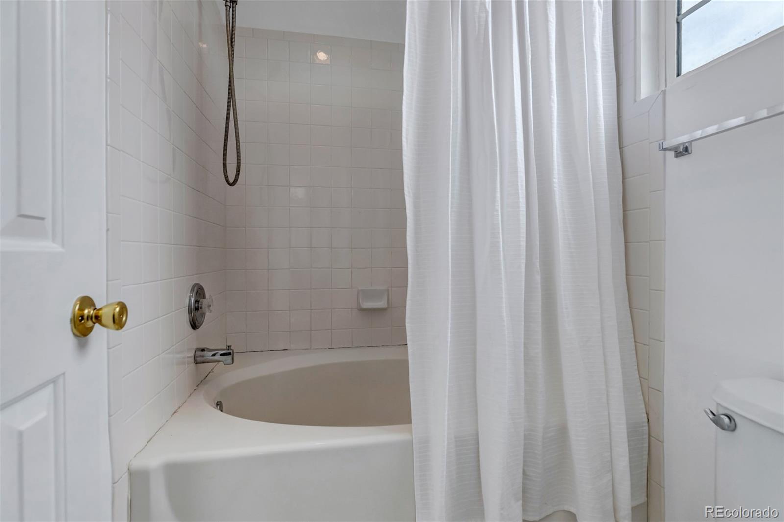 1237 Carlyle Park Circle Highlands Ranch, CO 80129 - Photo 21 of 33 a bathroom with a tub and shower