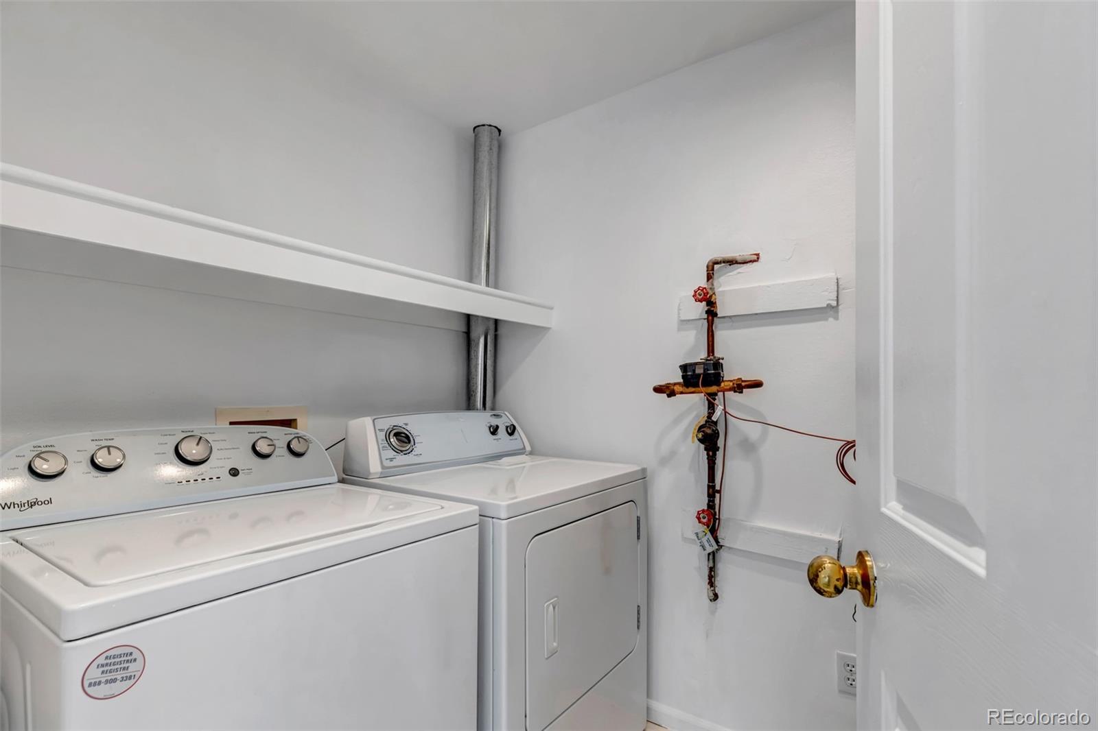 1237 Carlyle Park Circle Highlands Ranch, CO 80129 - Photo 25 of 33 a utility room with dryer and washer