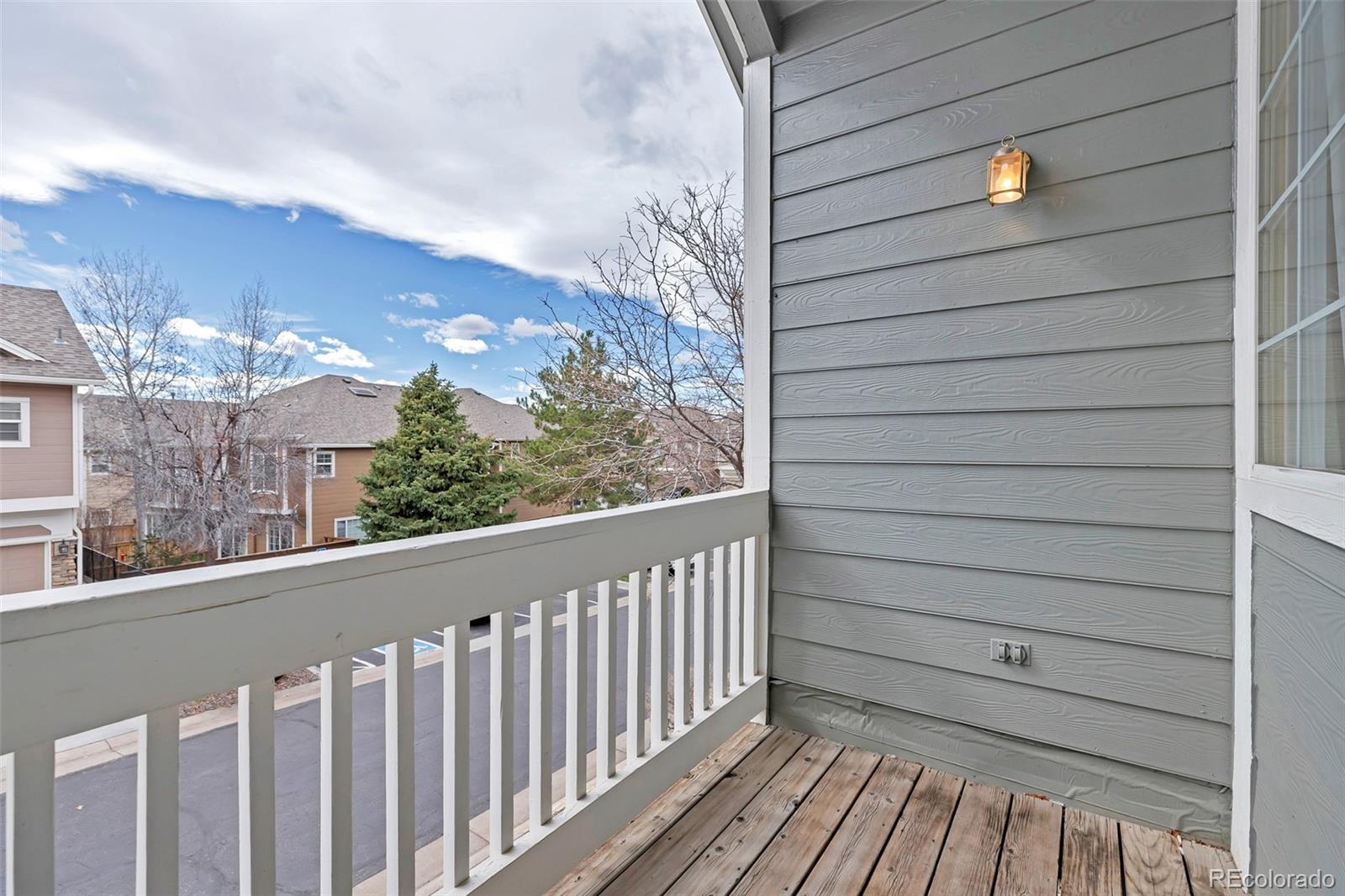 1237 Carlyle Park Circle Highlands Ranch, CO 80129 - Photo 26 of 33 a view of a balcony with wooden floor