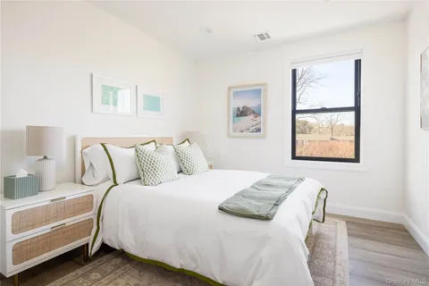 a bedroom with bed and a window