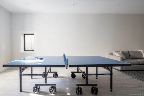 a reading room with furniture and wooden floor