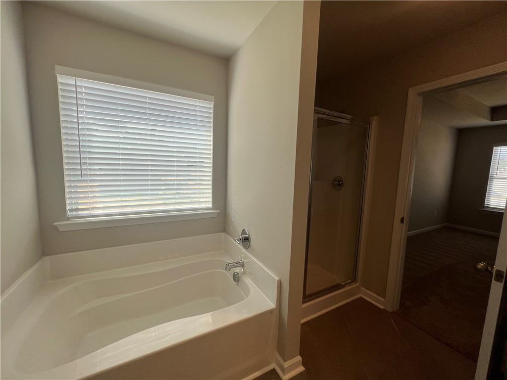 213 Cornwell Way Calhoun, GA 30701 - Photo 11 of 18 a bathroom with a bathtub and shower