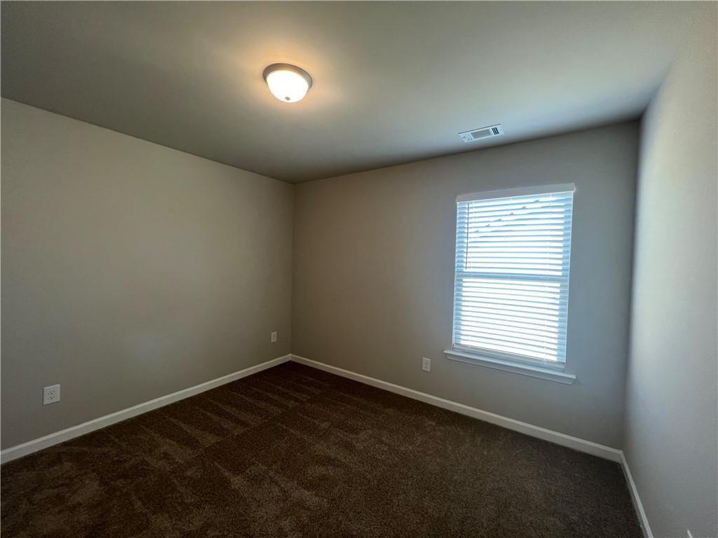 213 Cornwell Way Calhoun, GA 30701 - Photo 15 of 18 an empty room with a window