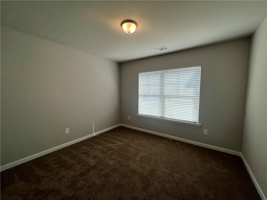 213 Cornwell Way Calhoun, GA 30701 - Photo 16 of 18 an empty room with a empty space and a window