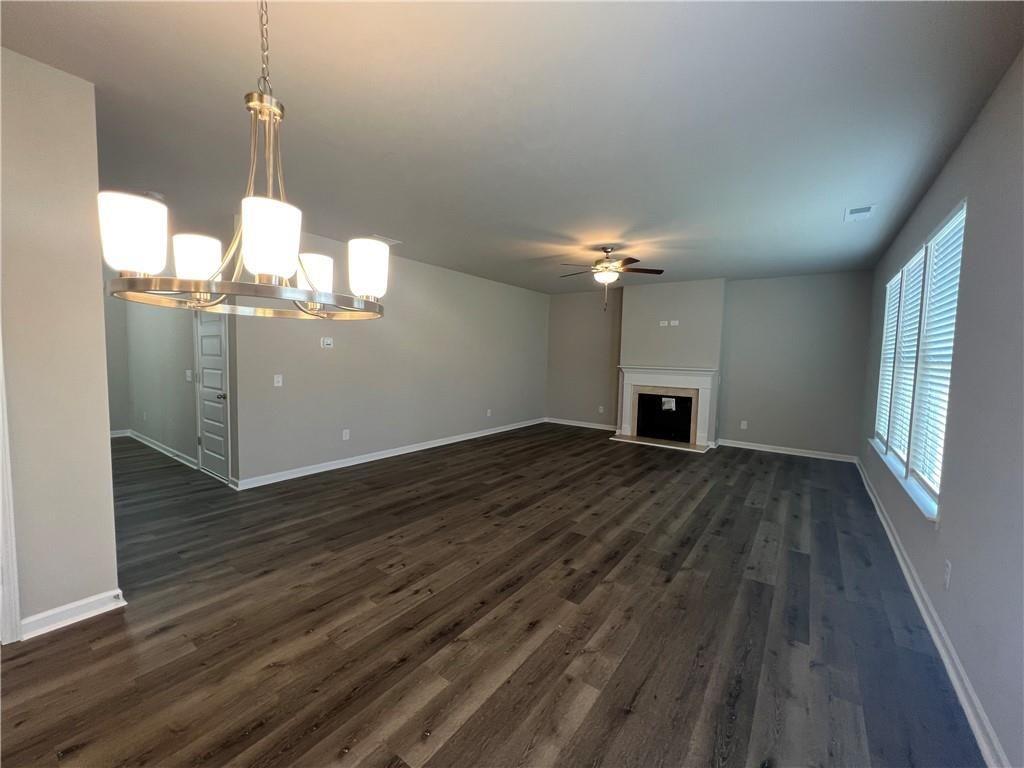 213 Cornwell Way Calhoun, GA 30701 - Photo 4 of 18 a room with wooden floor and a fireplace