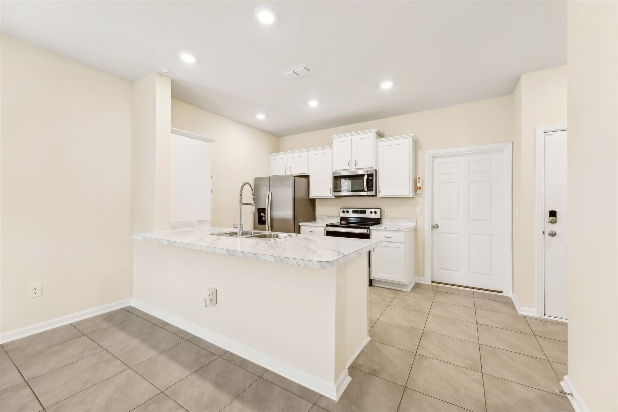 86440 Shortline Circle Yulee, FL 32097 - Photo 13 of 50 a kitchen with stainless steel appliances a refrigerator sink and microwave