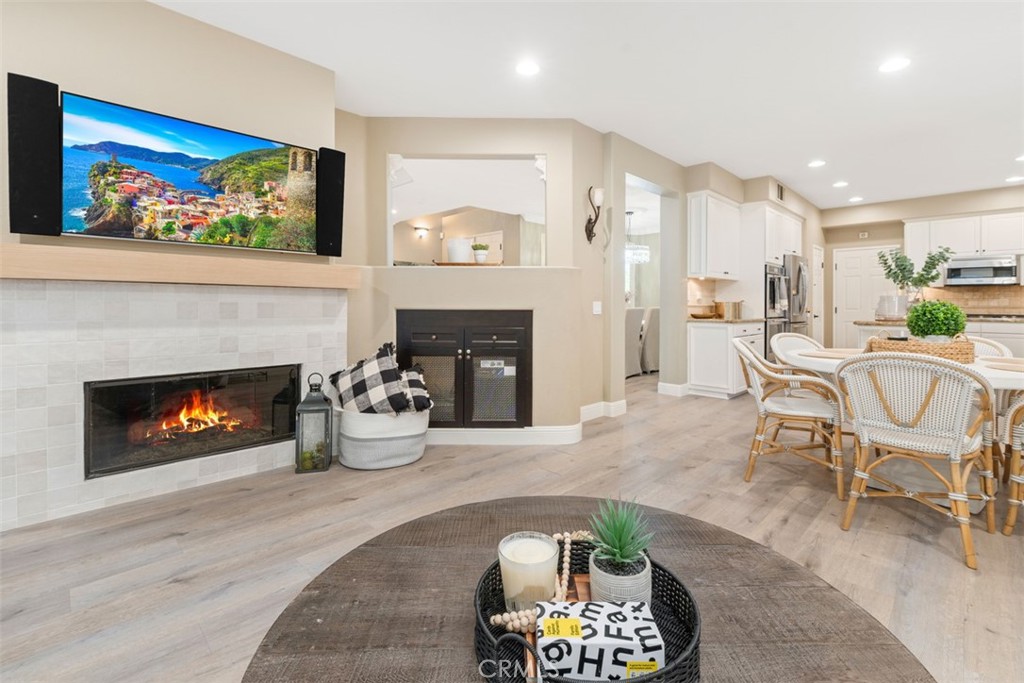 48 Creek View Road Coto de Caza, CA 92679 - Photo 12 of 39 a living room with furniture a fireplace and a flat screen tv