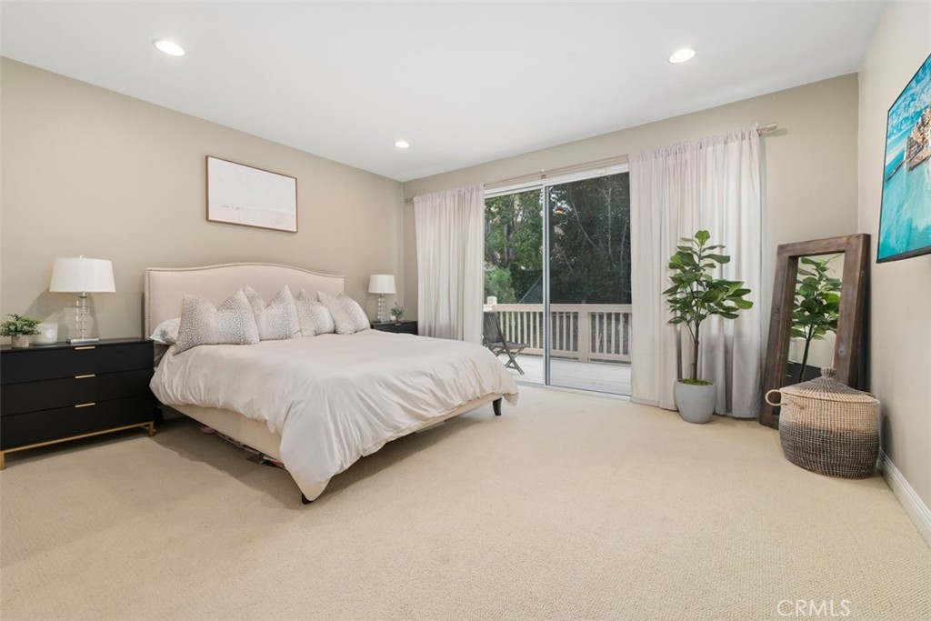 48 Creek View Road Coto de Caza, CA 92679 - Photo 18 of 39 a spacious bedroom with a bed and a large window