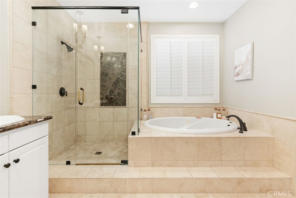 48 Creek View Road Coto de Caza, CA 92679 - Photo 21 of 39 a bathroom with a bathtub and shower