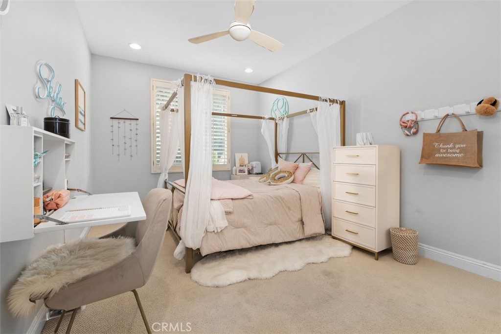 48 Creek View Road Coto de Caza, CA 92679 - Photo 24 of 39 a bedroom with furniture and a chandelier