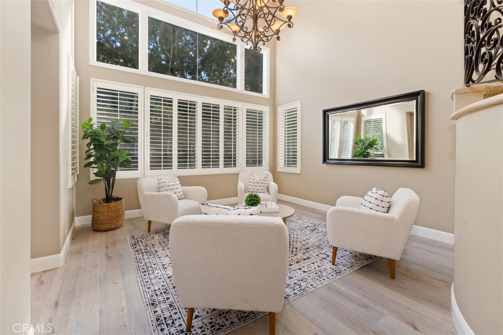 48 Creek View Road Coto de Caza, CA 92679 - Photo 5 of 39 a living room with furniture a large window and a potted plant