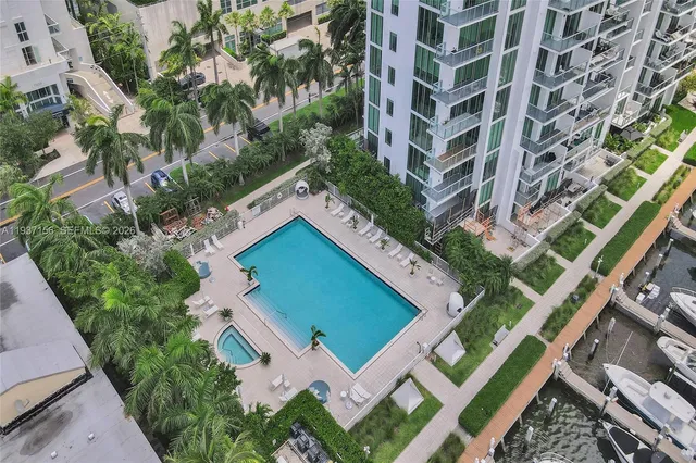 a kitchen with stainless steel appliances a microwave a stove and refrigerator