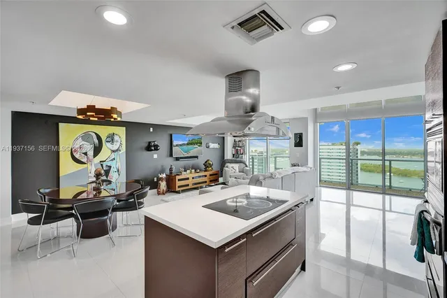 a bathroom with a toilet a sink a glass door a shower and a mirror