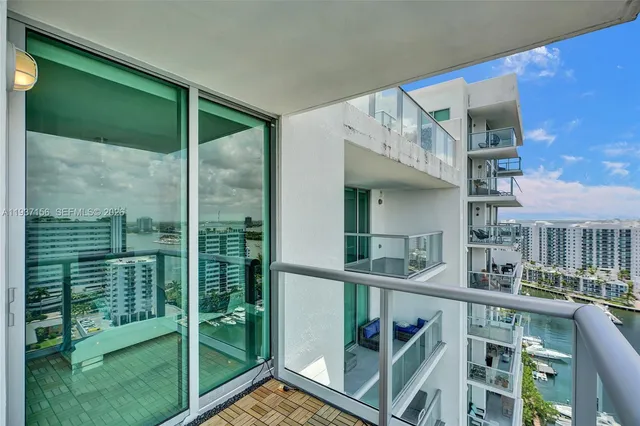 a view of a terrace with lawn chairs