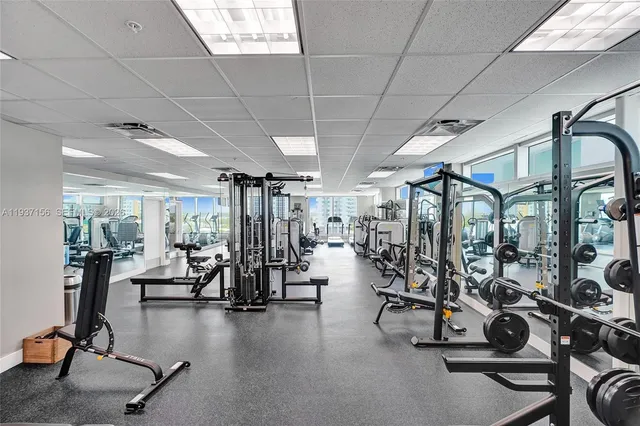 an aerial view of a residential apartment building with a yard