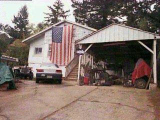 a view of a car park in front of house