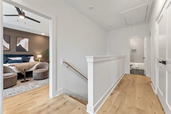 a en suite bathroom with a toilet sink and mirror