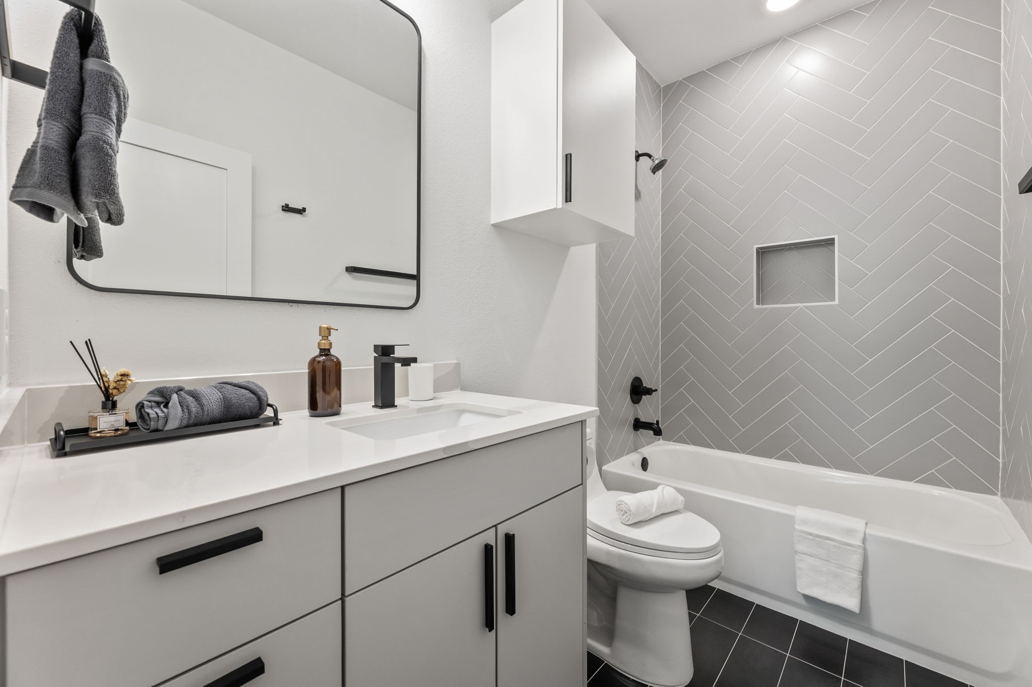 5502 Texas Street Houston, TX 77011 - Photo 21 of 33 a bathroom with a sink a toilet and mirror