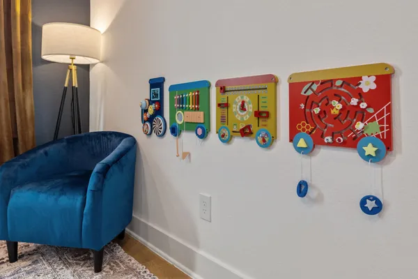 a view of a room that has a table and chairs