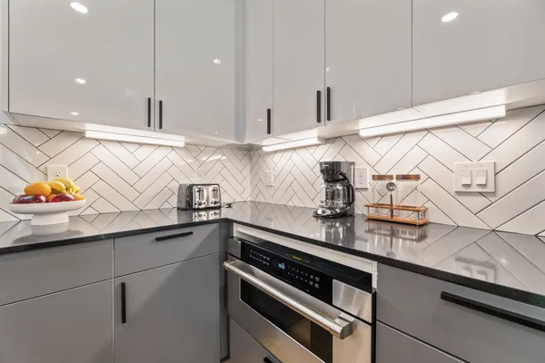 a kitchen with a sink and cabinets