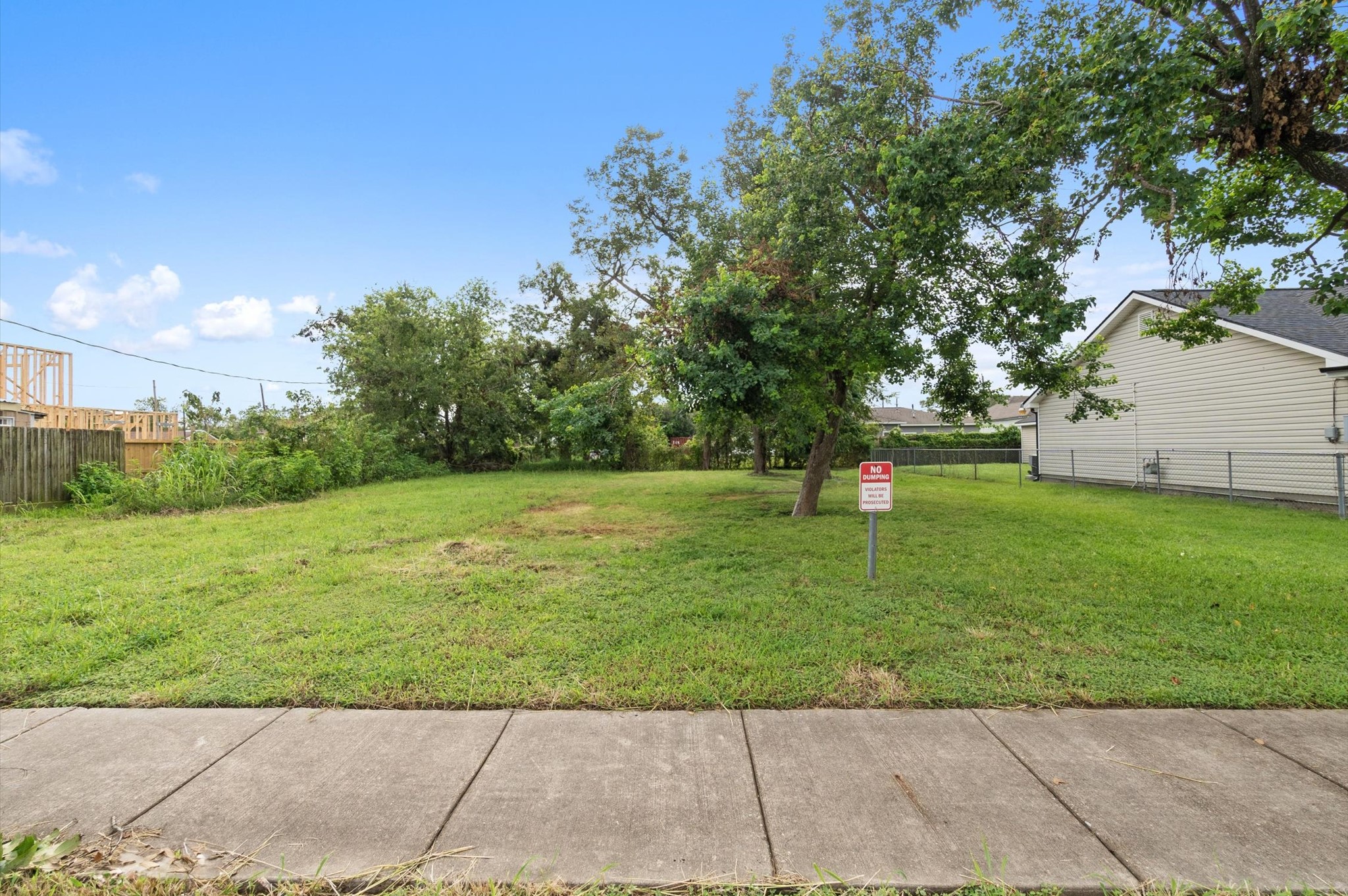 1711 Benson Street Houston, TX 77020 - Photo 1 of 11 a garden with trees in the background