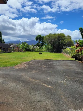 a view of a field with a big yard