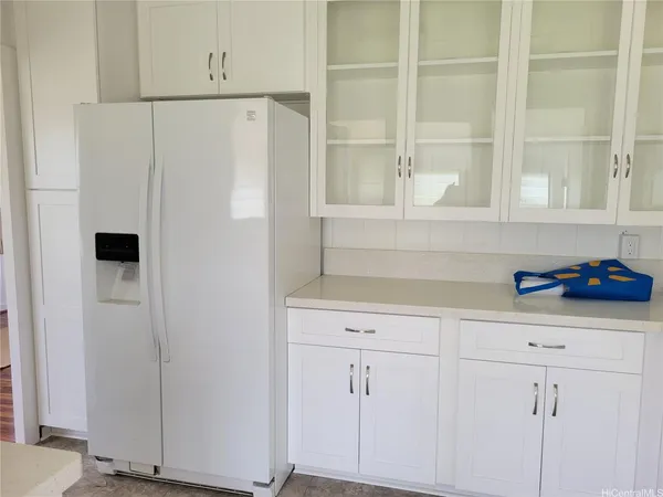 a white refrigerator freezer sitting inside of a kitchen