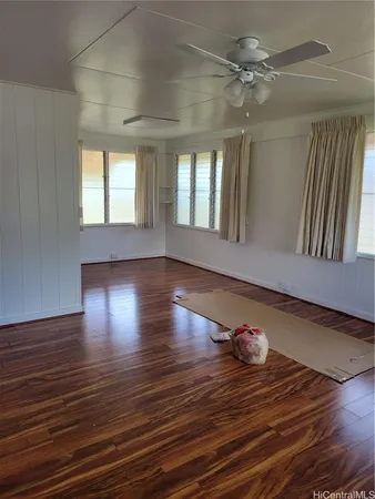a view of livingroom with hardwood floor and ceiling fan