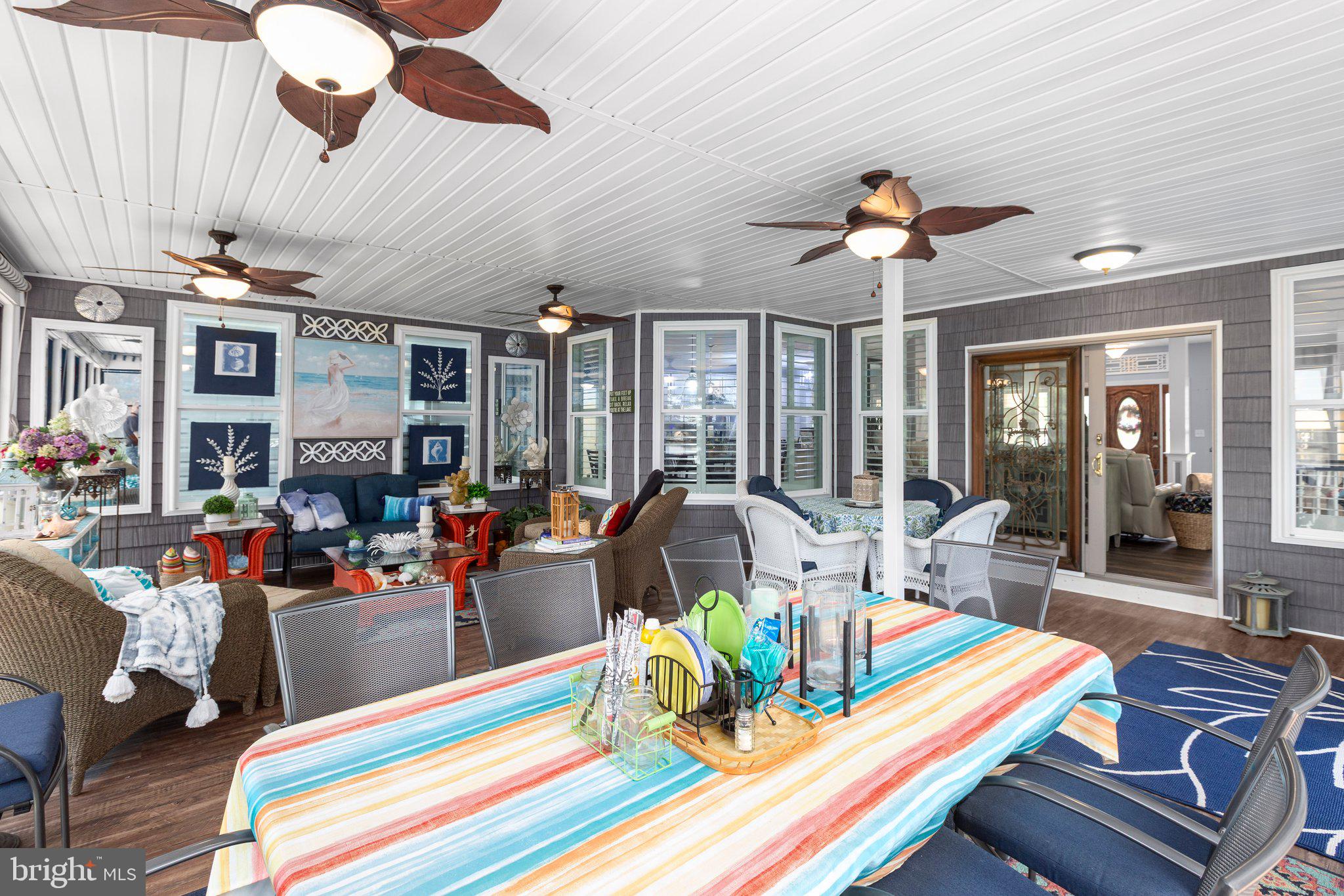 565 Busbees Point Road Bumpass, VA 23024 - Photo 20 of 135 Huge, comfortable 3 season room w/lake views