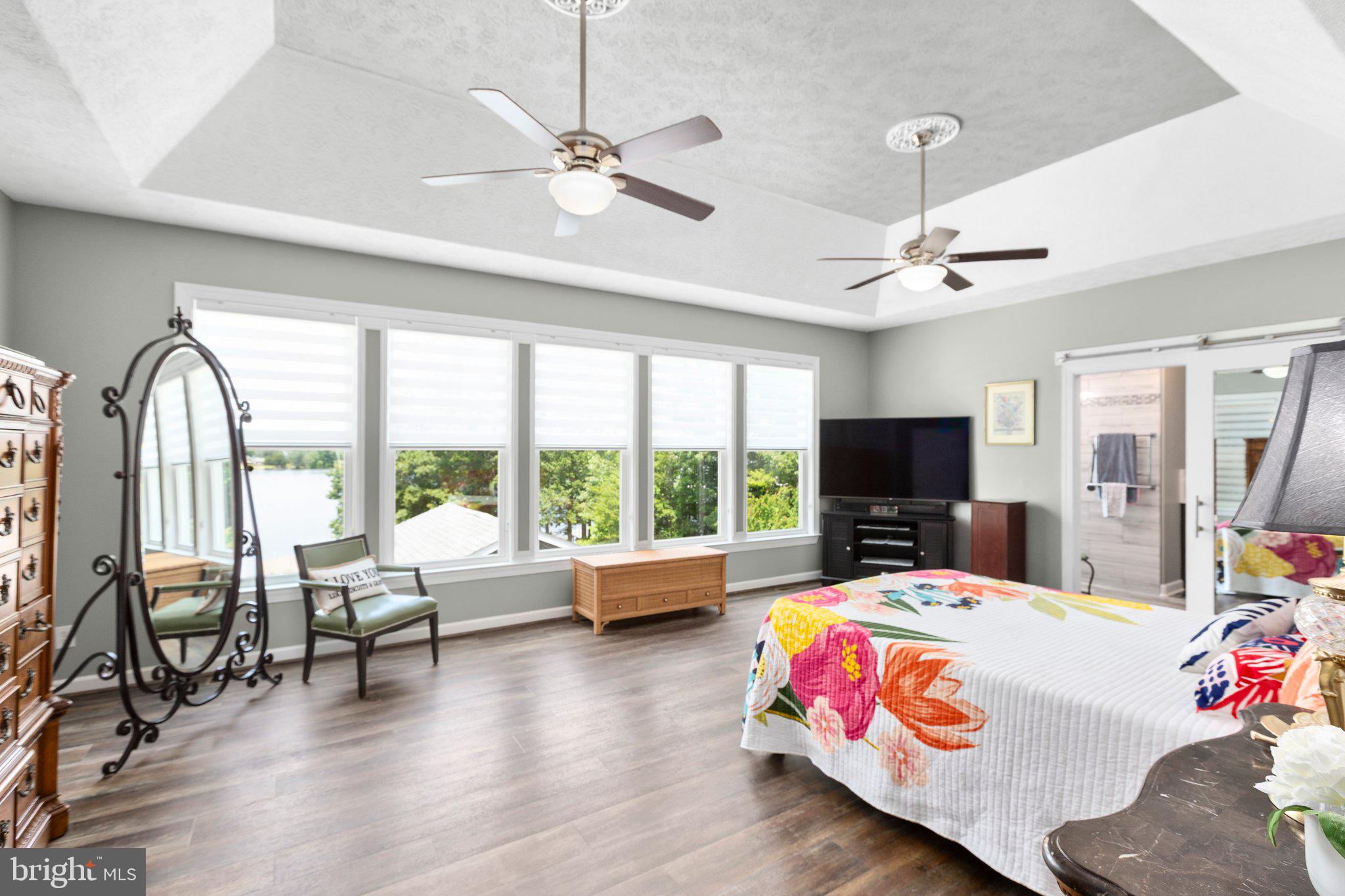 565 Busbees Point Road Bumpass, VA 23024 - Photo 27 of 135 Stunning ensuite bedroom with lake views