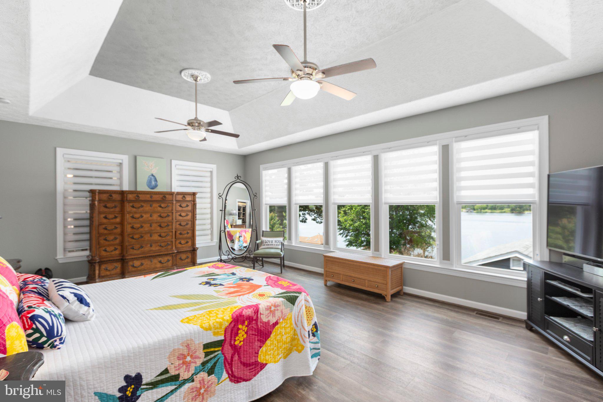 565 Busbees Point Road Bumpass, VA 23024 - Photo 28 of 135 Stunning ensuite bedroom with lake views