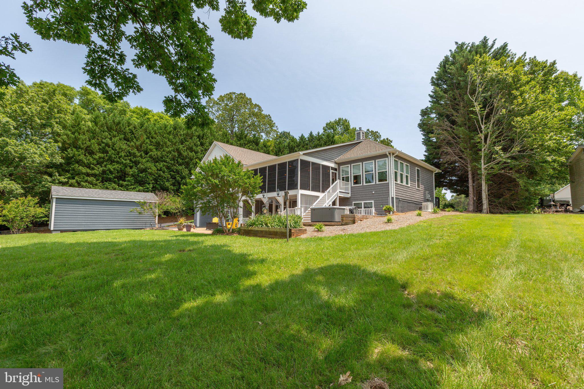 565 Busbees Point Road Bumpass, VA 23024 - Photo 58 of 135 Rear of home with patio and lake views