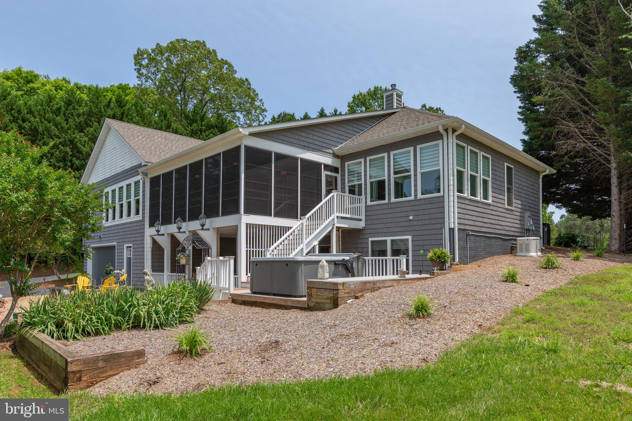 565 Busbees Point Road Bumpass, VA 23024 - Photo 59 of 135 Rear of home with patio and lake views