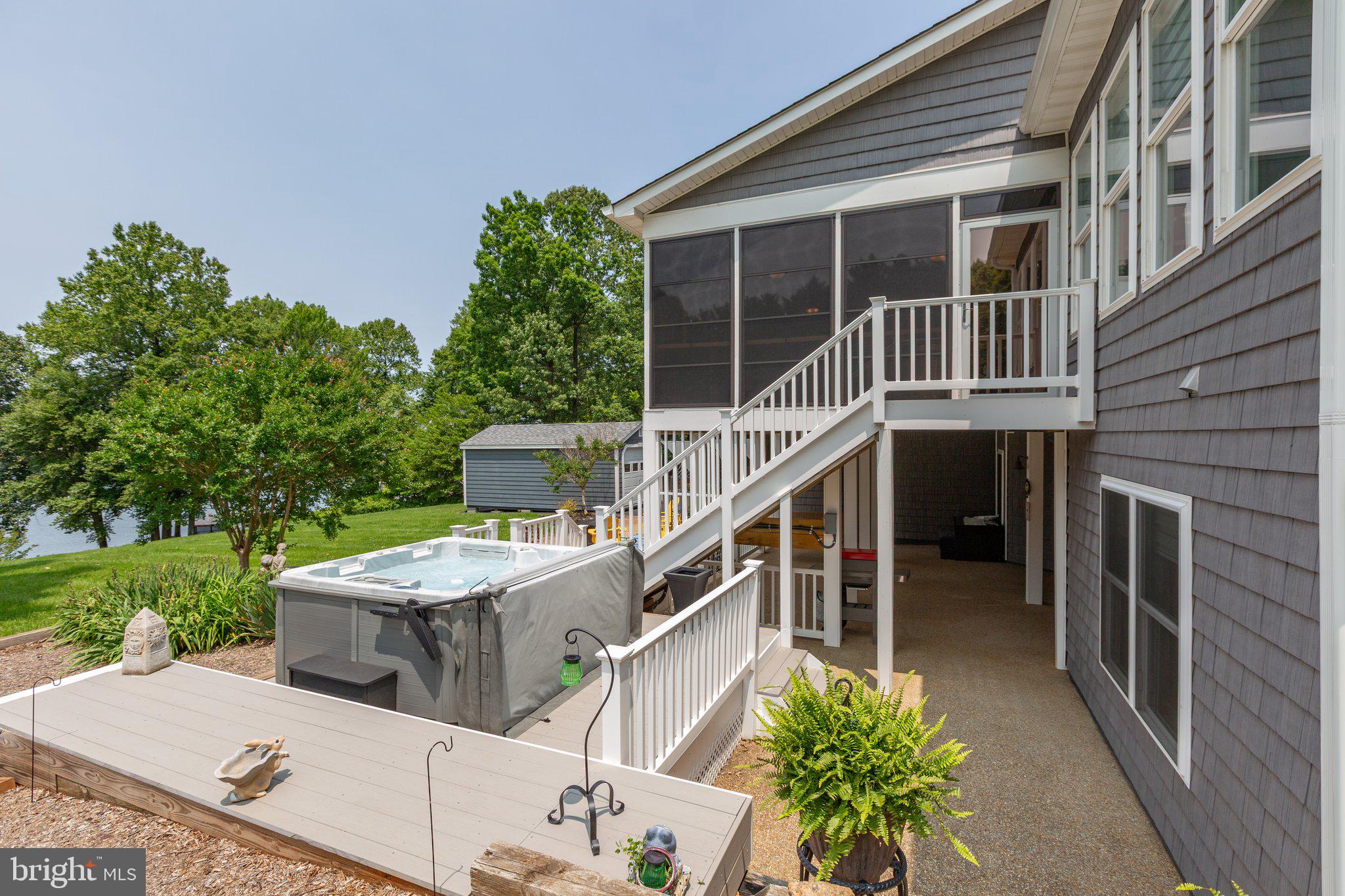 565 Busbees Point Road Bumpass, VA 23024 - Photo 61 of 135 Rear of home with hot tub and lake views