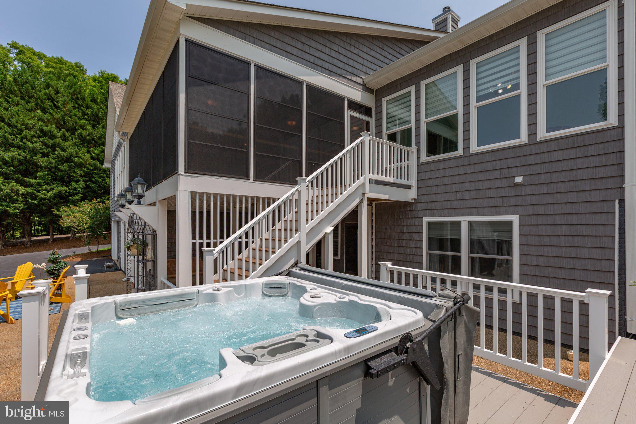 565 Busbees Point Road Bumpass, VA 23024 - Photo 62 of 135 Rear of home with hot tub and lake views