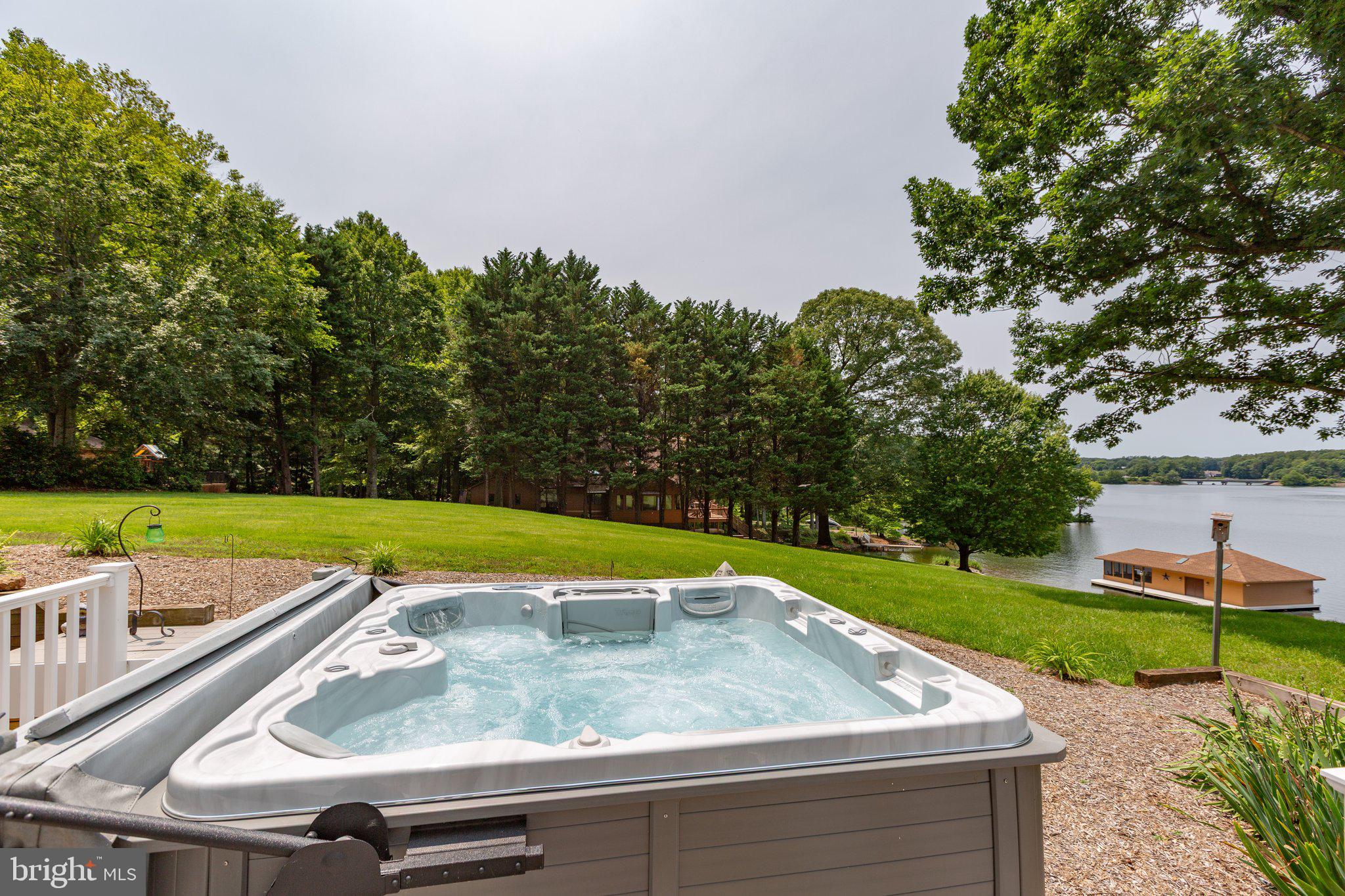 565 Busbees Point Road Bumpass, VA 23024 - Photo 63 of 135 Hot tub with lake views