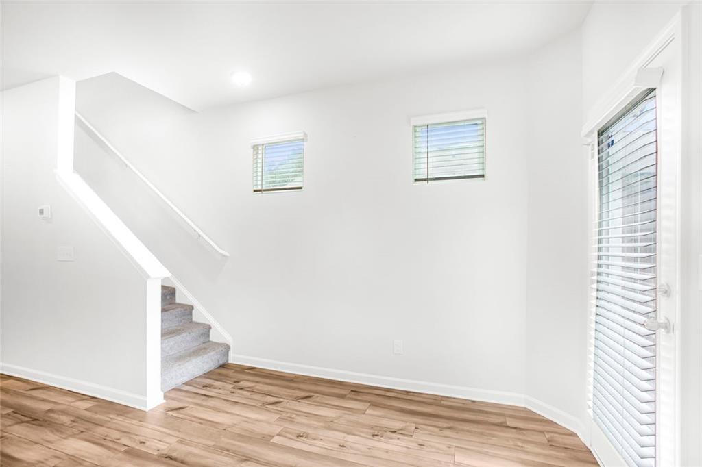 3570 Saratoga Circle Decatur, GA 30034 - Photo 13 of 26 a view of an empty room with wooden floor and a window