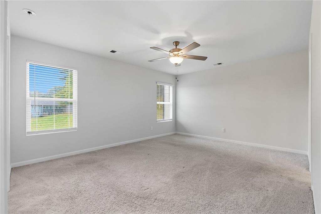 3570 Saratoga Circle Decatur, GA 30034 - Photo 16 of 26 an empty room with a window and a ceiling fan