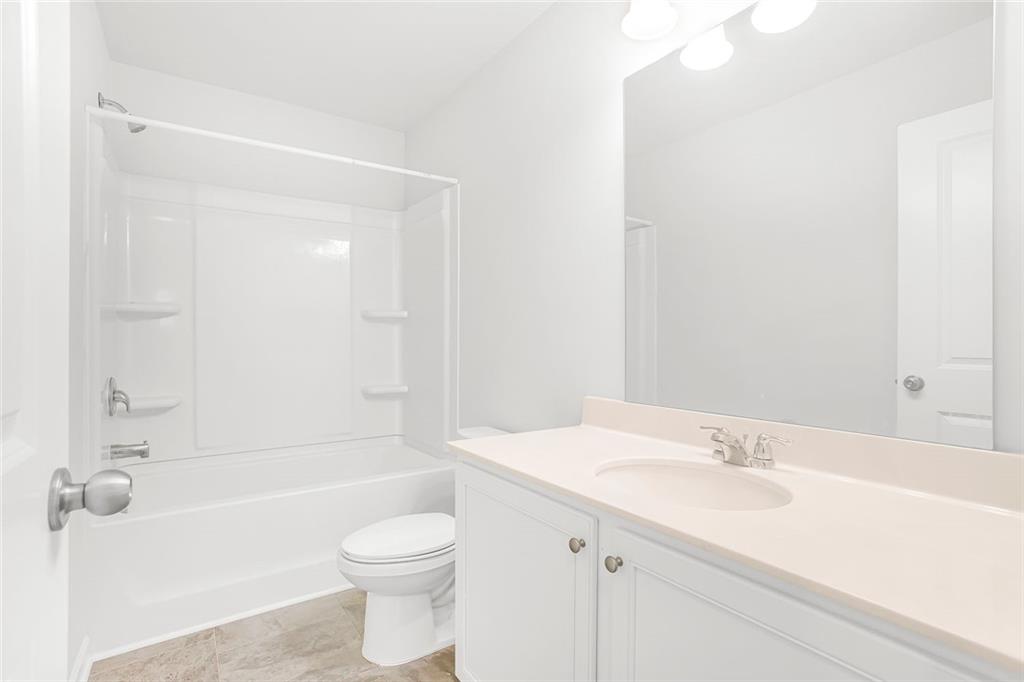 3570 Saratoga Circle Decatur, GA 30034 - Photo 20 of 26 a bathroom with a sink a toilet and shower