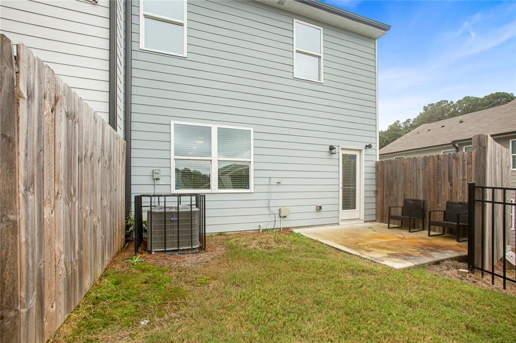 3570 Saratoga Circle Decatur, GA 30034 - Photo 24 of 26 a view of a house with a backyard and a window