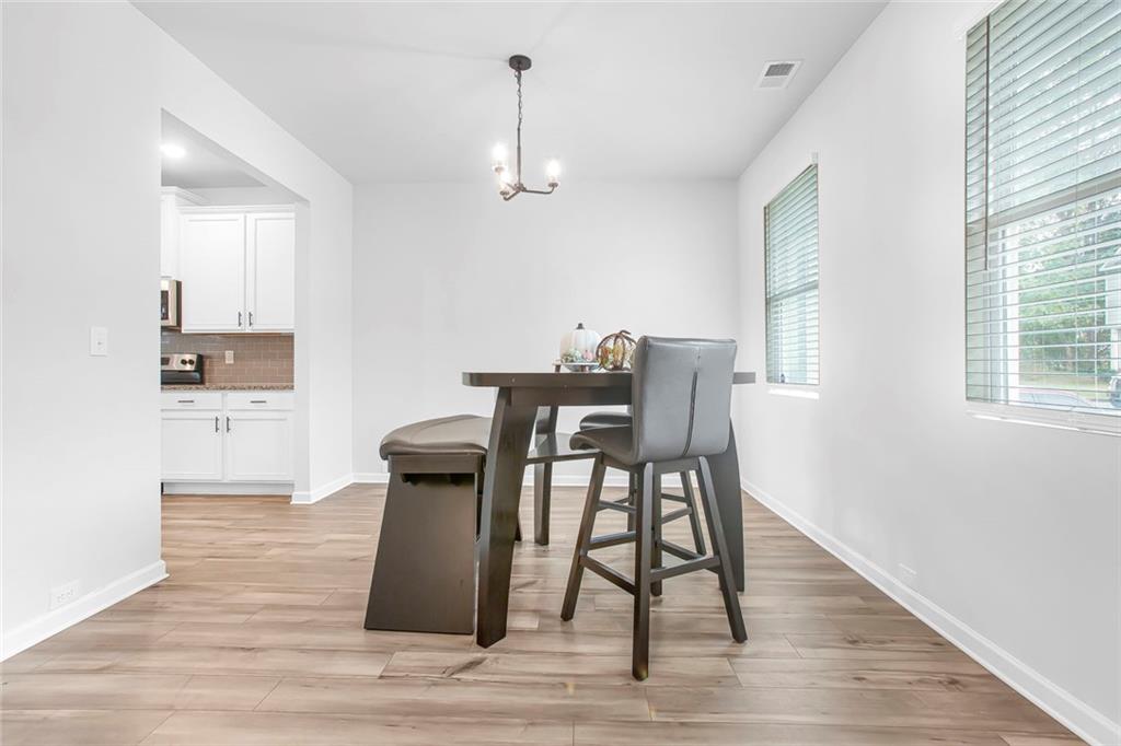 3570 Saratoga Circle Decatur, GA 30034 - Photo 4 of 26 a view of a dining room with furniture and wooden floor